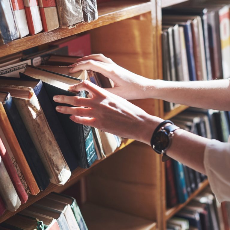 a row of shelves in a public library containing public domain books