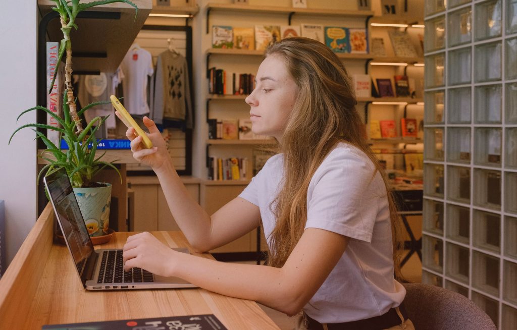 a woman with blond hair testing the buying process online after integrating an online book store on her author website 