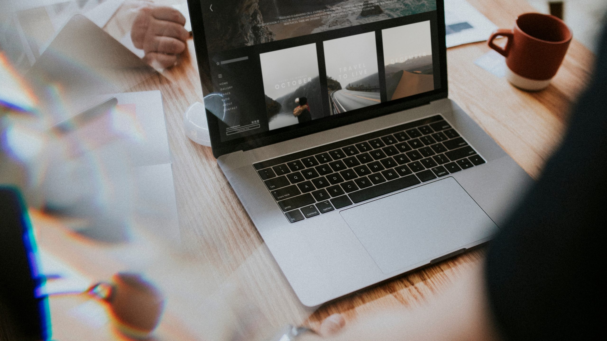 a group of people sitting around a table working on a website and writing a blog about seo content for writers